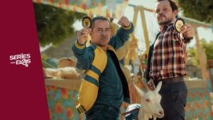 Dois homens com cabra em feira.